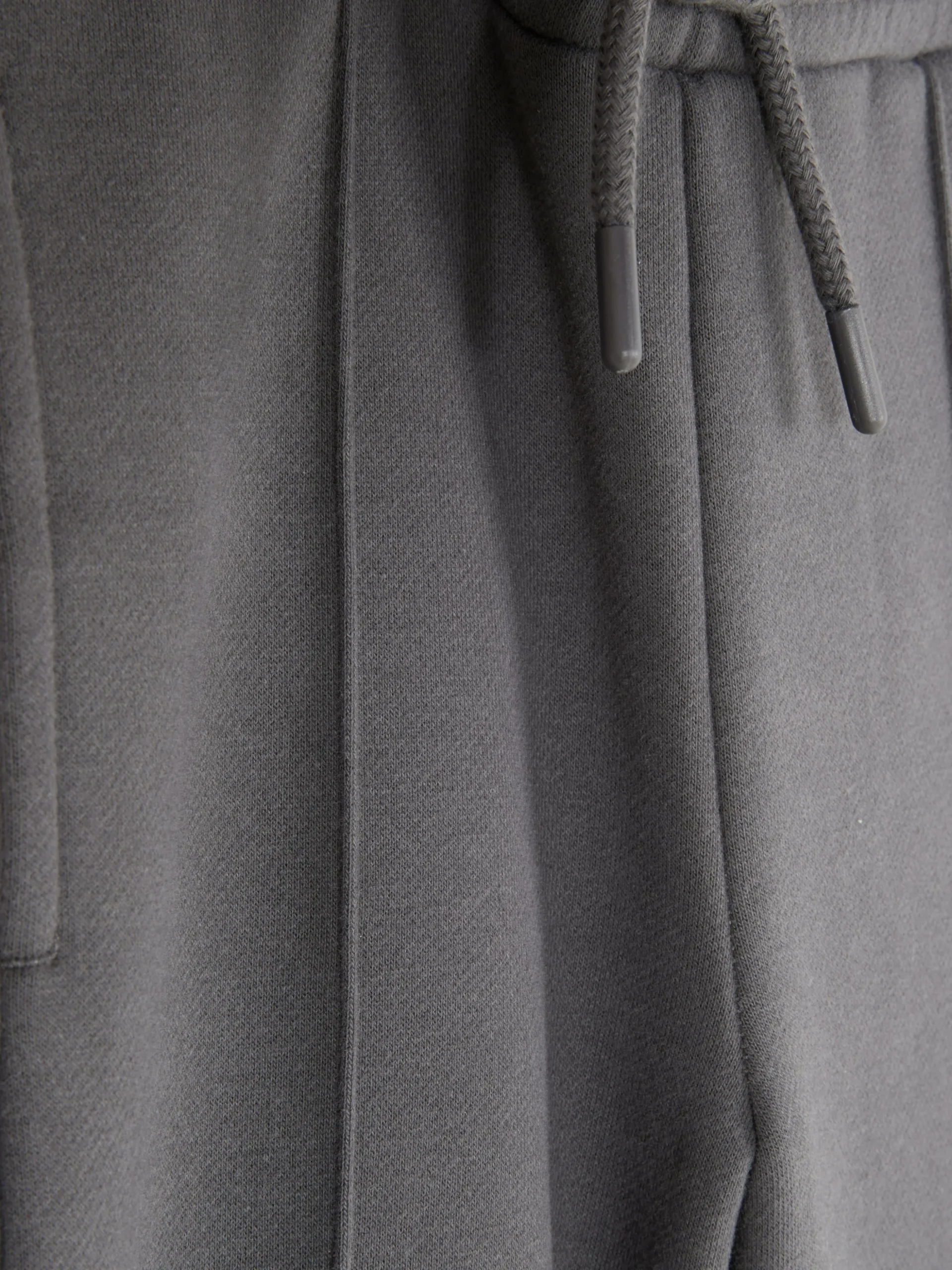 Calças Treino Cordão Corte Perna Larga