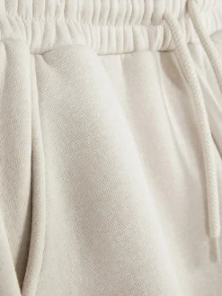 Calças Treino Corte Perna Larga