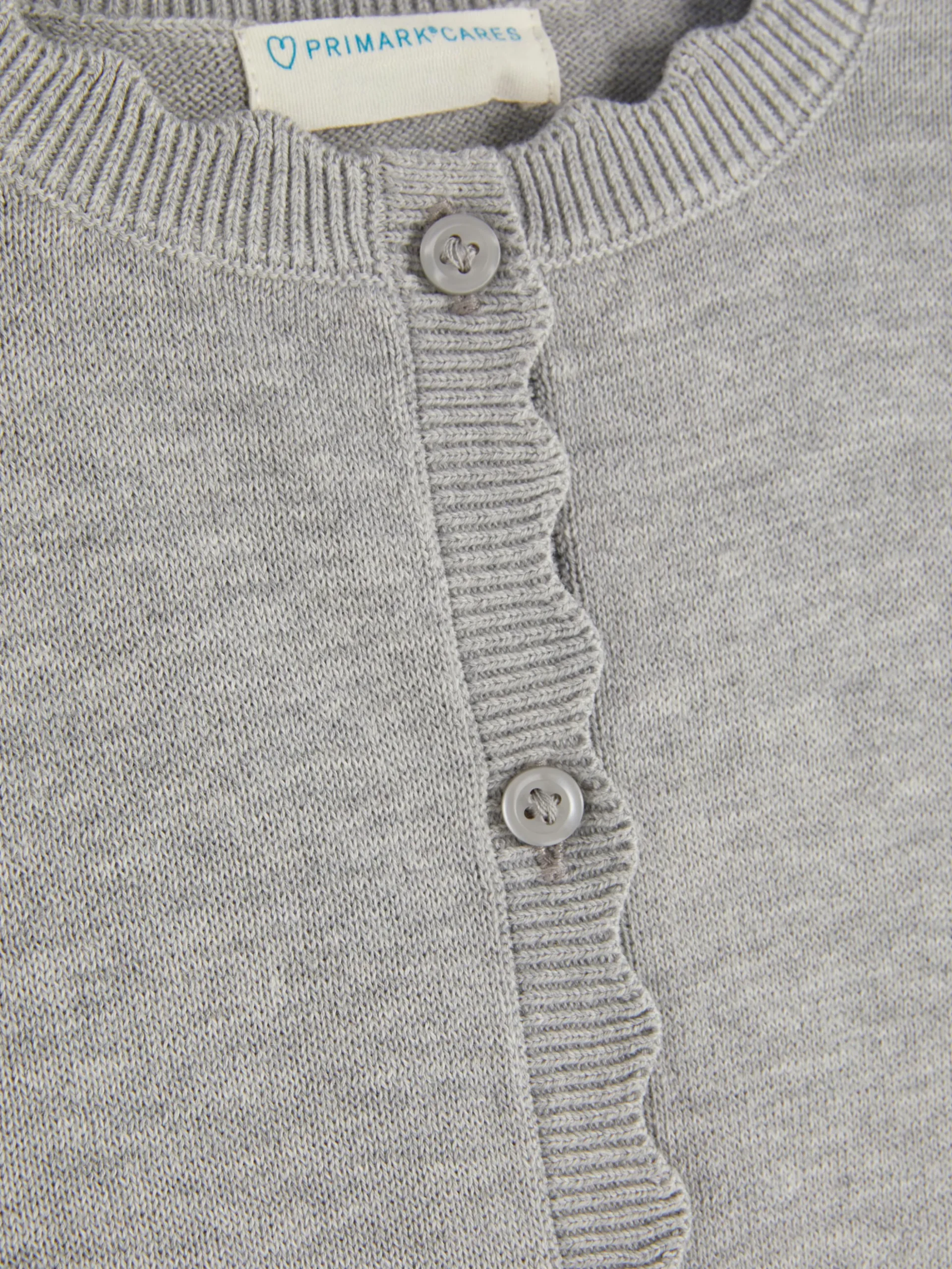 Casaco Malha Botões Recortes